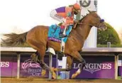  ?? MICHAEL CONROY AP ?? John Velazquez rides Authentic to victory in the Breeders’ Cup Classic at Keeneland Race Course.