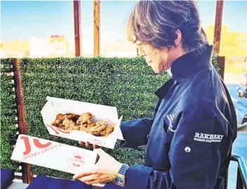  ?? COURTESY PHOTO COURTESY PHOTO ?? Junya Watanabe shows off his latest culinary creation, Junya’s Crispy Karaage at his RakiRaki Ramen location on Convoy Street in San Diego. It’s on the new menu introduced last week.