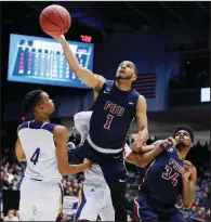  ?? AP/JOHN MINCHILLO ?? Fairleigh Dickinson’s Darnell Edge (middle) scored a career-high 33 points, as the Knights defeated Prairie View A&M 82-76 at the NCAA Men’s Tournament in Dayton, Ohio.