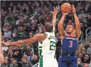  ?? EPA/EFE ?? Wizards guard Bradley Beal shoots over Bucks forward Khris Middleton on Wednesday.