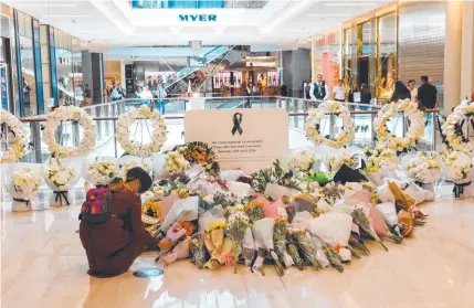  ?? ?? Floral tributes at Bondi Junction Westfield for those who were murdered. Picture: David Swift