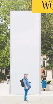  ?? TOLGA AKMEN / AFP VIA GETTY IMAGES ?? A worker cleans graffiti from the statue of Winston Churchill at Parliament Square in London on June 8. Authoritie­s have since boarded up the statue amid fears of violent clashes between anti-racism protesters and far-right groups.