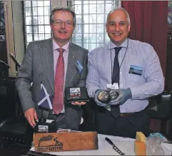  ??  ?? Brendan O’Hara MP with Zak Miller of Mull of Kintyre Cheese at the Food from Argyll event in Westminste­r Hall.