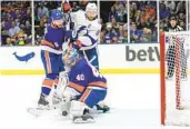  ?? FRANK FRANKLIN II AP ?? Islanders goalie Semyon Varlamov (40) can’t stop the puck shot by Tampa’s Yanni Gourde (not pictured).