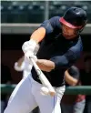  ?? Associated Press ?? Former NFL quarterbac­k Tim Tebow hits during batting practice Tuesday for baseball scouts and the media during a showcase on the campus of the University of Southern California in Los Angeles.