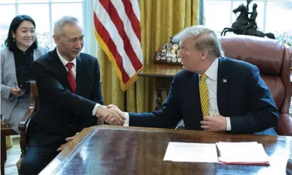  ??  ?? Donald Trump with China’s vice-premier Liu He at the White House last week. Photograph: UPI/Barcroft Images