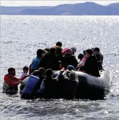  ?? DHA VIA AP ?? Migrants board a dinghy as they try to reach a Greek island on Friday as NATO envoys were holding emergency talks on Syria.