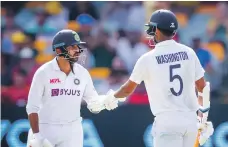  ?? AFP ?? Washington Sundar and Shardul Thakur put on 123 runs for the seventh wicket in Brisbane. India’s previous best was 58