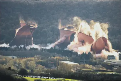  ?? PICTURE: JOHN HAYWARD/SWNS ?? END OF AN ERA: The cooling towers at Ironbridge Power Station are demolished in a controlled explosion.