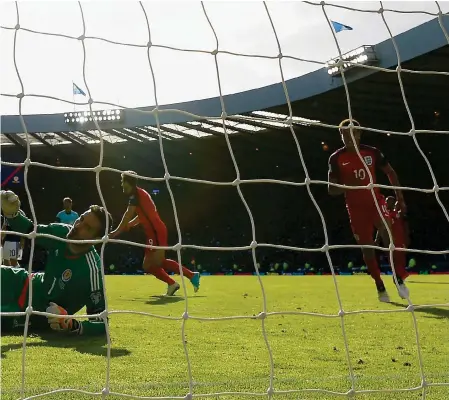  ?? Photograph: Getty ?? volleys home at Hampden to rescue a point for the visitors