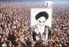  ?? AFP/Getty Images ?? A PORTRAIT of Ayatollah Ruhollah Khomeini in Tehran in January 1979. By that June, Iran’s secular monarchy had been replaced by the Islamic Republic.