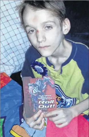  ?? GOVERNMENT OF ALBERTA VIA CP ?? Alexandru Radita is shown in a photo from his 15th birthday party, three months before his death, in this handout photo. Emil and Rodica Radita were found guilty nearly a year ago in Calgary of first-degree murder of the 15-yearold, who weighed just 37...