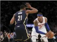  ?? FRANK FRANKLIN II — THE ASSOCIATED PRESS ?? Indiana Pacers’ Thaddeus Young (21) defends New York Knicks’ Carmelo Anthony (7) during the second half Tuesday in New York. The Knicks won 87-81