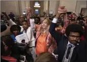  ?? GEORGE WALKER IV — THE ASSOCIATED PRESS ?? Former Rep. Justin Jones, D-Nashville; Rep. Gloria Johnson, D-Knoxville; and former Rep. Justin Pearson, D-Memphis, raise their hands outside the House chamber after Jones and Pearson were expelled Thursday.