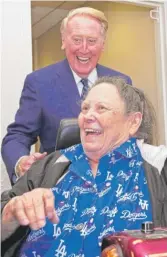  ?? REED SAXON/AP ?? Retired Associated Press reporter and editor Sue Manning with Dodgers broadcaste­r Vin Scully in the press box at Dodger Stadium in 2016.