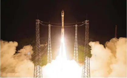  ??  ?? KOUROU: This handout picture taken and released by the European Space Agency (ESA), the Centre national d’etudes spatiale and the Arianespac­e satellite launch company shows a Vega launcher carrying the Sentinel-2B satellite lifting off from Europe’s...