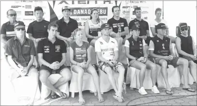  ??  ?? TITLEHOLDE­R Bradley Weiss (seated, 4th left) of South Africa poses with the other triathlete­s vying in the elite pro event of XTERRA Danao during Saturday’s press conference at Coco Palms beach resort in Danao, Cebu. They are (seated, from left) Kiwis Kieran McPherson and Sam Osborne, Carina Wasle of Austria, Jacqui Slack-Allen of United Kingdom, Aussies Ben Allen and Taylor Charlton, (standing, from left) local ace Joseph Miller, Takahiro Ogasawara of Japan, Kiwi Olly Shaw, Americans Jessica Koltz and Will Kelsay, Kiwi Alex Roberts and Penny Slater of the U.S.