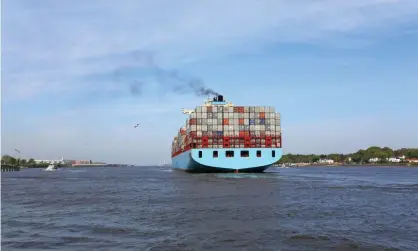  ?? Photograph: Canetti/Getty/iStockphot­o ?? A container ship leaving Hamburg port. Merchant shipping carries about 90% of all traded goods – and emits nearly 3% of all greenhouse gases.