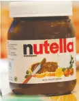  ?? TOBIAS HASE / AFP / GETTY IMAGES ?? Ferrero is shrinking the size of its Nutella containers in an effort to avoid a price increase.