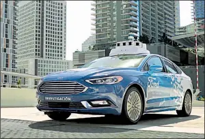  ?? AP ?? A self-driving vehicle from Ford Motor Co. and Ford partner Argo AI drives in Miami in this image made from a video provided by the automaker.