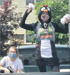  ?? COURTESY OF HERITAGE OF GREEN HILLS ?? Cheryl Anderson, Well by Design Director, takes part in a “snowball” fight in a penguin costume at the Heritage of Green Hills. With her is Madi LaBelle, a food server, who threw the “snowballs” back at the residents.