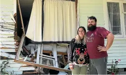  ?? GERALD PIDDOCK/STUFF ?? Matthew and Melissa McAdams have a large hole in the side of their house after a car ploughed into it, hitting their bed while they were sleeping.