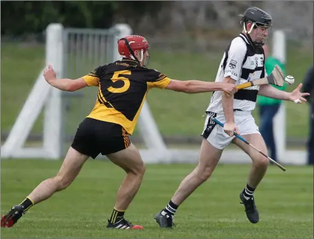  ??  ?? Ballyhea’s James O’Leary is tackled by Fermoy’s Greg Lardner during last weekend’s Division 2 Hurling League semi-final replay in Buttevant. Photo by Eric Barry