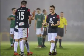  ??  ?? David Cawley and Patrick McClean celebrate a vital win. Photos: Sportsfile