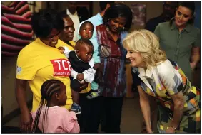  ?? (AP/Dirk Heinrich) ?? U.S. First Lady Jill Biden (right) reacts during a visit to a U.S. President’s Emergency Plan for AIDS Relief (PEPFAR) project at an informal settlement Thursday near Windhoek, Namibia.