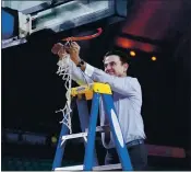  ?? MATT SLOCUM — THE ASSOCIATED PRESS ?? Coach Rick Pitino cuts the net after Iona’s 60-51 victory over Fairfield on Saturday in the title game of the Metro Atlantic Athletic Conference Tournament in Atlantic City, N.J.