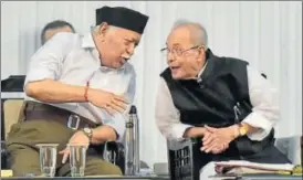  ?? AP PHOTO ?? Former President Pranab Mukherjee (right) interacts with RSS chief Mohan Bhagwat during an event in Nagpur on Thursday.