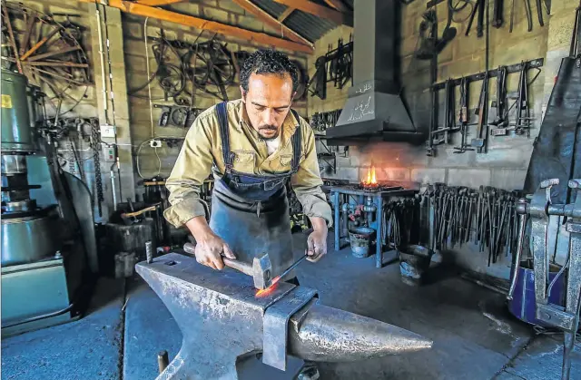  ??  ?? Kashief Booley of Prince Albert comes complete with an anvil, a forge and a passion for fire – just like in the old storybooks.