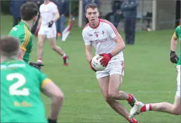  ??  ?? Louth’s Conor Early looks towards the post after finding some space during Sunday’s match against Meath.