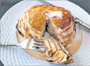  ?? AP PHOTO/ELIZABETH KARMEL ?? This undated photo shows ripe banana pancakes. The bananas are mashed as if making banana bread and added to the batter right before the pancakes are prepared. The result is almost like banana bread pancakes.