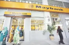  ??  ?? Maybank’s growth potential in the Asean region has been viewed positively by analysts, despite the on-going challenges seen in the overall banking industry. — Reuters photo