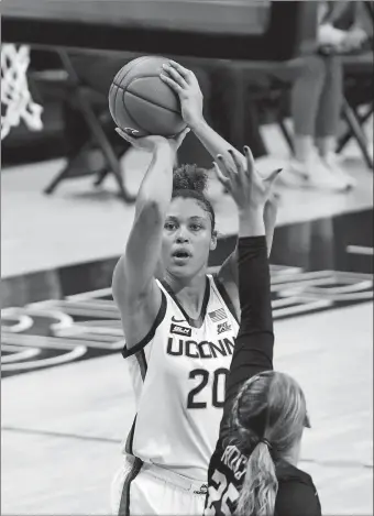  ?? DAVID BUTLER II/POOL PHOTO/AP PHOTO ?? UConn forward Olivia Nelson-Ododa (20) shoots against Butler forward Ellen Ross (25) in the first half of Tuesday’s game in Storrs. UConn won 103-35.