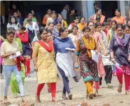  ?? — PTI ?? Candidates emerge from an examinatio­n centre after appearing in LT Grade ( assistant teacher) examinatio­n in Ghaziabad on Sunday.