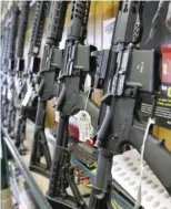  ??  ?? Semi- automatic AR- 15’ s for sale in Orem, Utah. An AR- 15 was used in the school shooting in Parkland, Florida.
| GEORGE FREY/ GETTY IMAGES