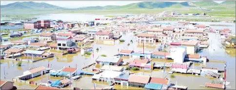  ??  ?? A flooded village is seen in Zoige County, Sichuan, China in this still image taken from a video obtained from social media. — Reuters photo