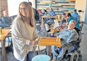  ?? KAYLA O’BRIEN/STAFF PHOTOGRAPH­ER ?? Tina Kadolph, left, opened her cafe, Palate Coffee Brewery in Sanford, as a way to raise money and awareness about human traffickin­g. The coffeehous­e is completely staffed by volunteers.