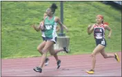  ?? STAFF PHOTO BY TED BLACK ?? St. Charles High School sophomore Laila Dupree, center, edges past Northern’s Jasmine Simpson and Arionna Johnson to capture their heat of the girls’ 200-meter dash on Tuesday.