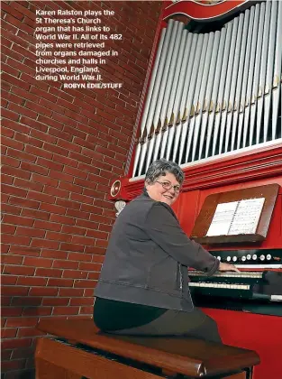  ?? ROBYN EDIE/STUFF ?? Karen Ralston plays the St Theresa’s Church organ that has links to World War II. All of its 482 pipes were retrieved from organs damaged in churches and halls in Liverpool, England, during World War II.