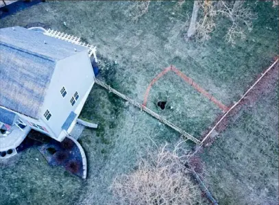  ?? Eric Friedman ?? This overhead photo shows a sinkhole that formed in West Whiteland Township, Chester County, exposing Sunoco's Mariner East 1 pipeline on Jan. 20.