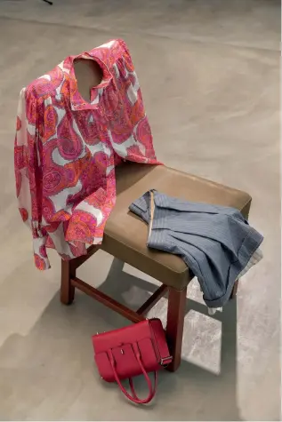  ??  ?? From left, shirt, Dh2,040, Zimmermann at Shopbop. Shorts, Dh4,115, Chloe. New Drag Bag, Dh39,715, Hermès Dress, Dh37,517, Carolina Herrera New York. Necklace, Dh1,595, Elisabetta Franchi
Lady D-lite bag, Dh16,500, Christian Dior. SuperVee bag, Dh7,170, Valentino
Jumper, Dh8,100, Valentino. Bumbag, Dh4,550, Christian Louboutin