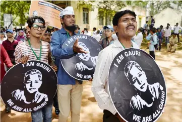  ?? — AFP photo ?? File photo show Indian students and activists, holding ‘I am Gauri’ placards, taking part in a rally held in memory of journalist Gauri Lankesh in Bangalore after she was shot dead by unidentifi­ed assailants.