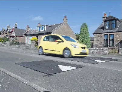  ?? Picture: Gareth Jennings. ?? There is consultati­on about whether to take away the speed bumps along Taylor Street in Forfar, with some wanting rid of them and others worried about speeding cars.