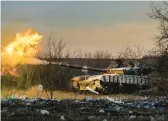  ?? EFREM LUKATSKY/AP ?? A Ukrainian tank deployed with the 17th Tank Brigade fires at Russian positions on Thursday in Chasiv Yar in the eastern Donetsk region.