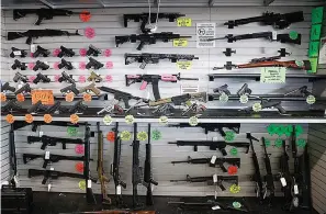  ?? ?? Various types of guns on display for sale at Uncle Dan's Pawn Shop in Mesquite, Texas, on Aug. 16, 2022. (Elías Valverde II/The Dallas Morning News/TNS)