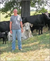  ??  ?? Michael Lanier was not raised on a farm but has been adapting to the farm lifestyle and work since he married the former Jenny Whatley Ables eight years ago. The Laniers raise Angus-based cattle on the family farm they share with Jenny’s parents in the Rolla community in Hot Spring County.