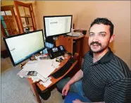  ?? DAVID ZALUBOWSKI/AP PHOTO ?? Danny Aguilar in his home in Lakewood, Colo.